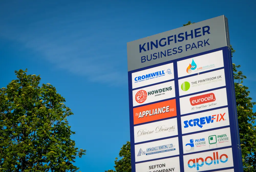 Kingfisher Business Park occupier totem against a blue sky