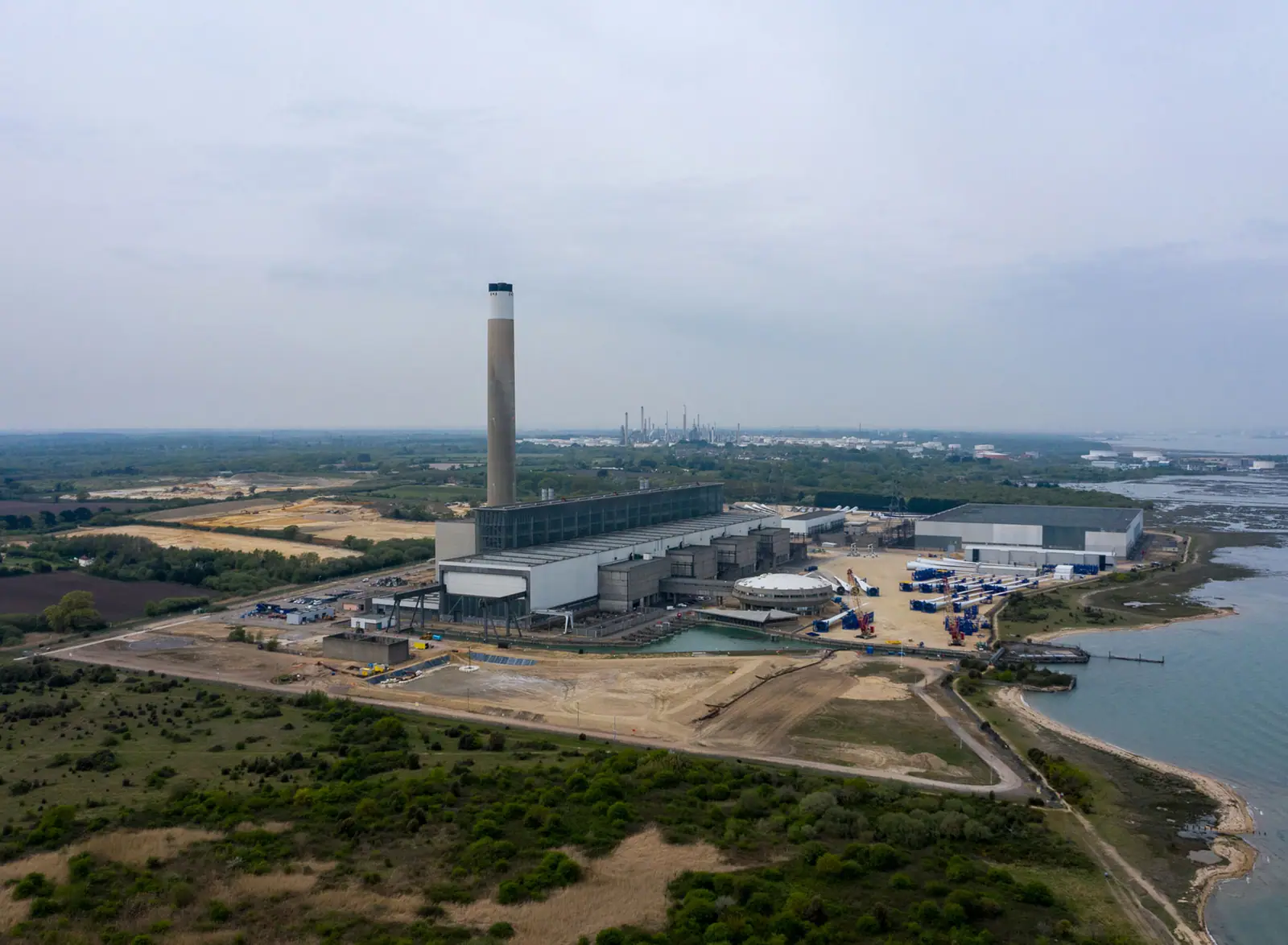Drone view of a coastal power station and development land