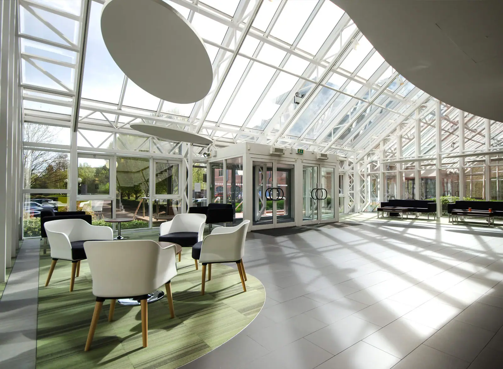 Glazed office atrium with seating