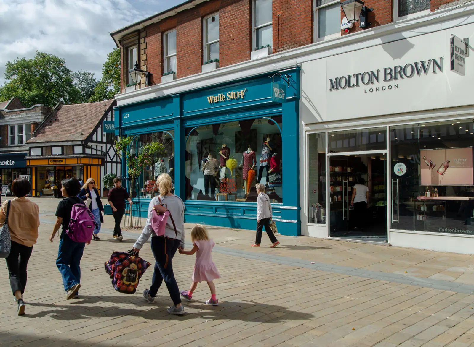Shoppers outside a high-street parade