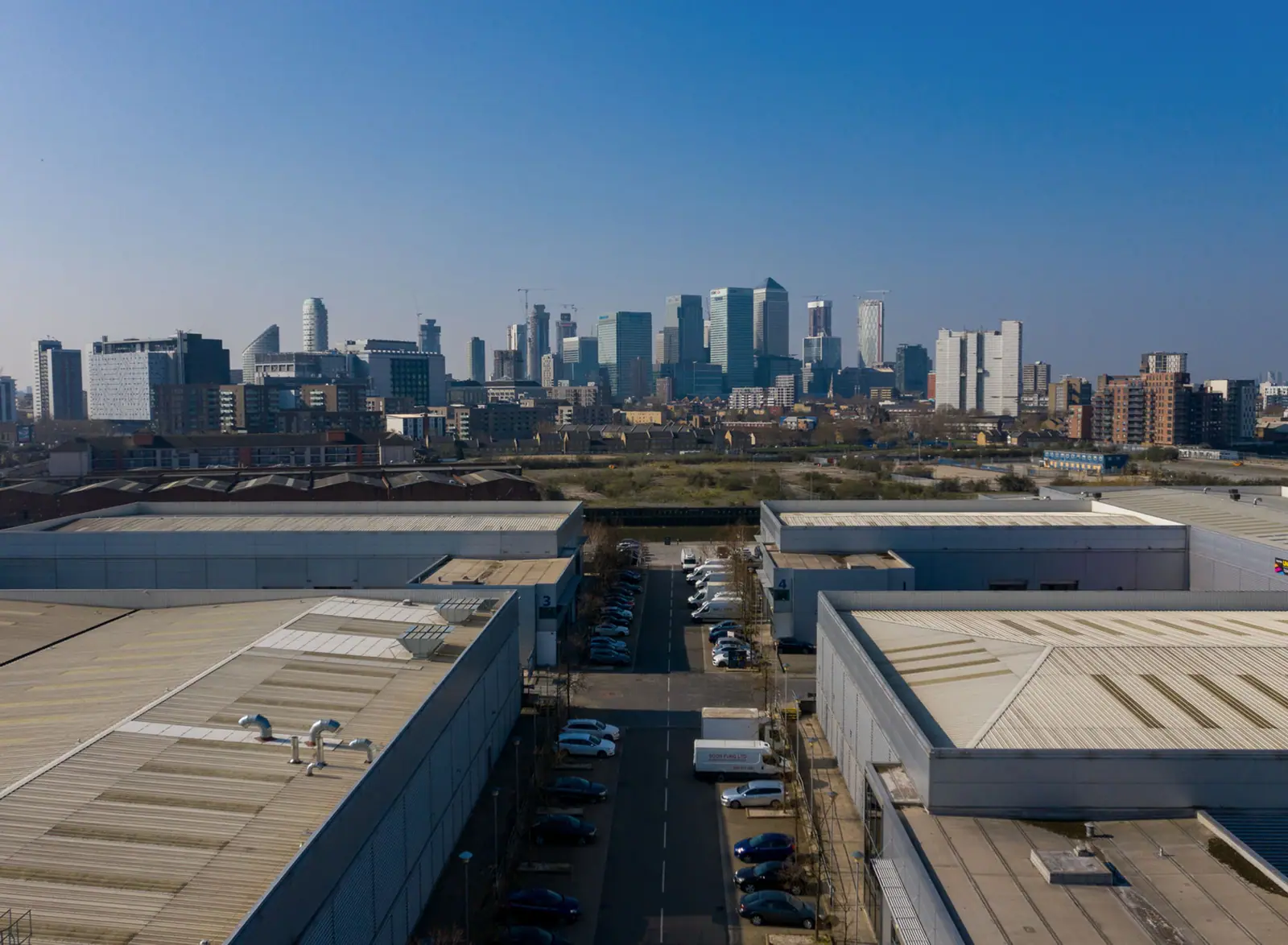 Drone view across London with Canary Wharf