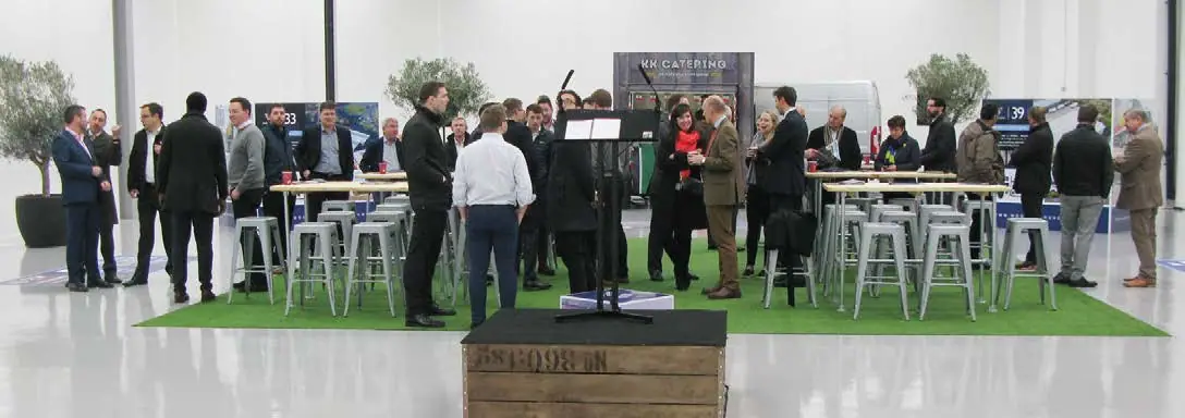 Guests at a launch event inside a new unit
