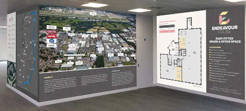 Marketing suite wall with a site plan and aerial