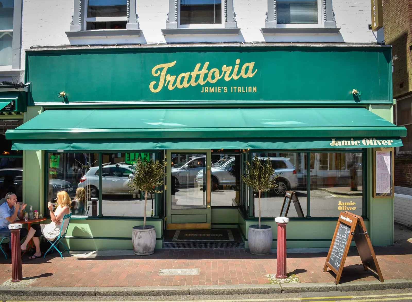 Jamie's Italian Trattoria's green shopfront and pavement seating on Tunbridge Wells High Street