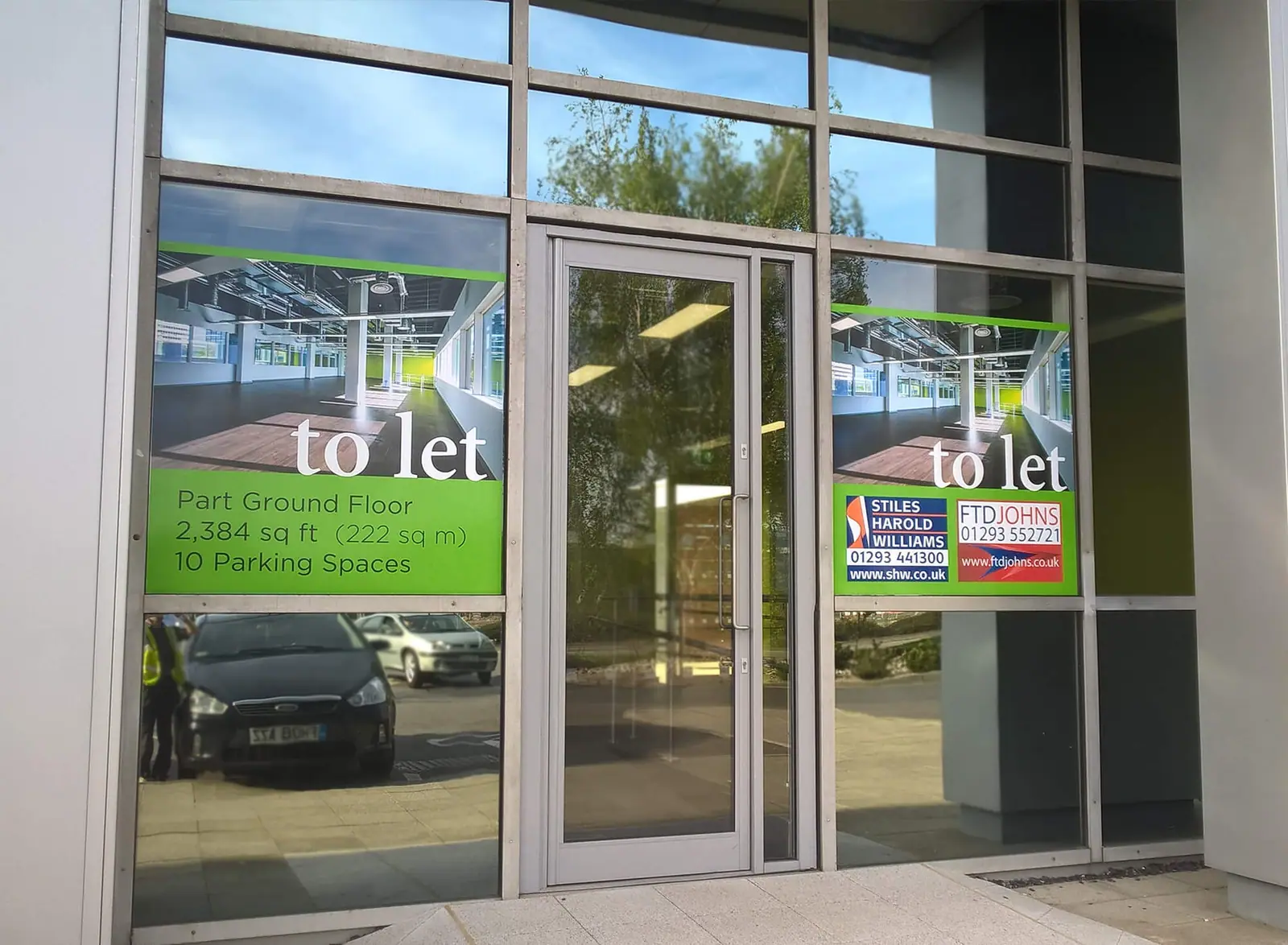Astral Towers entrance with 'to let' window graphics