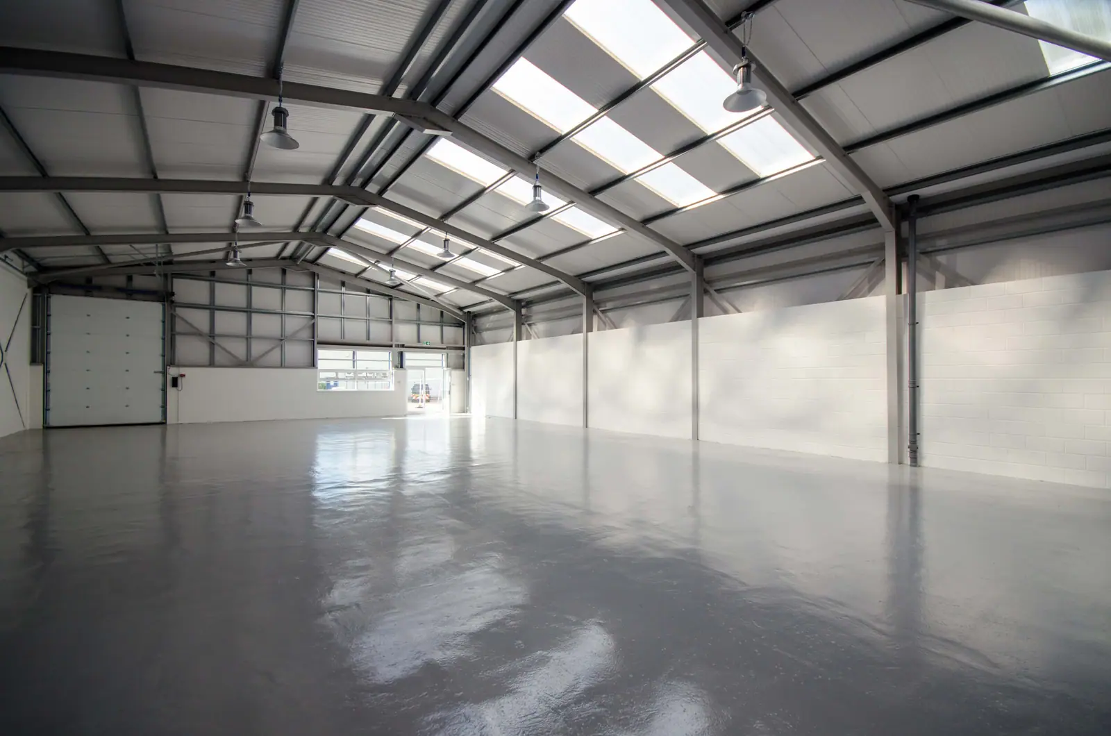 Refurbished empty warehouse unit with new roof lights