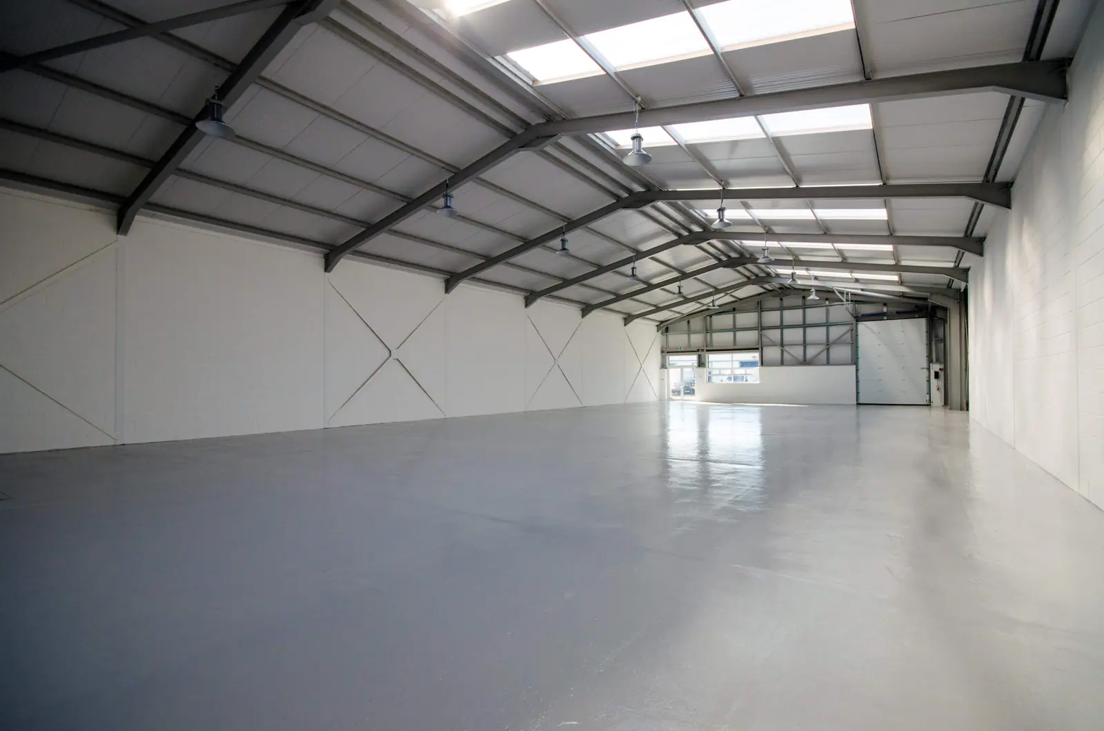 Bright warehouse interior with roof lights