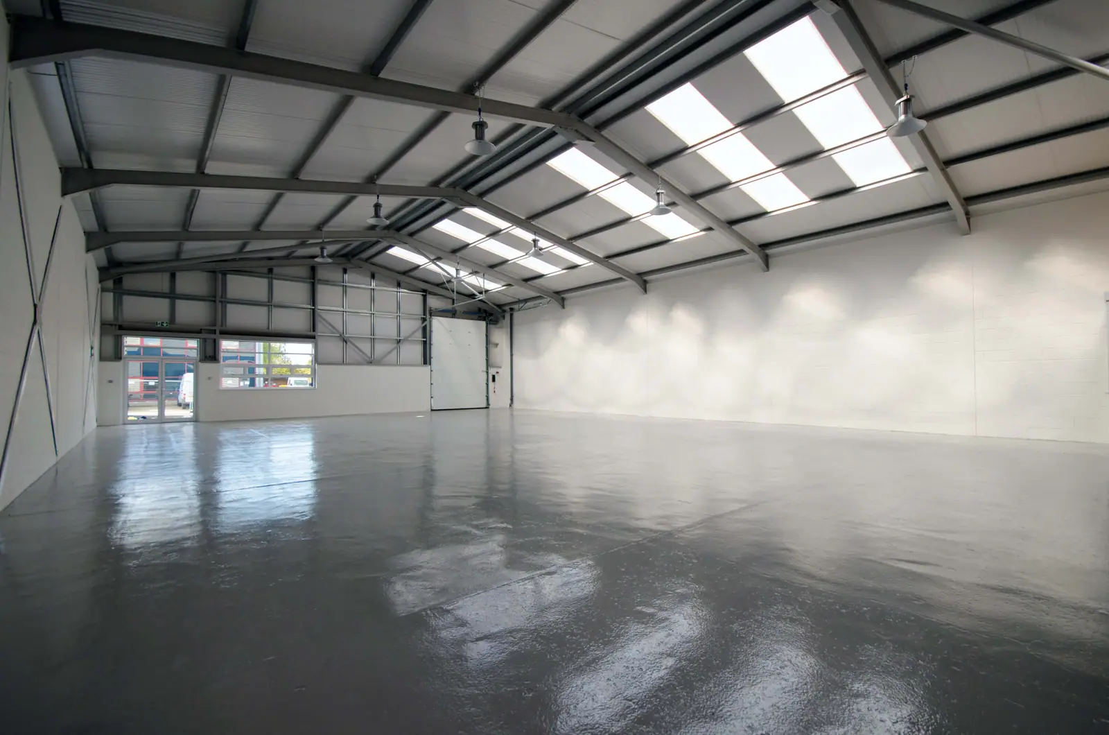 Empty warehouse with an open roller door
