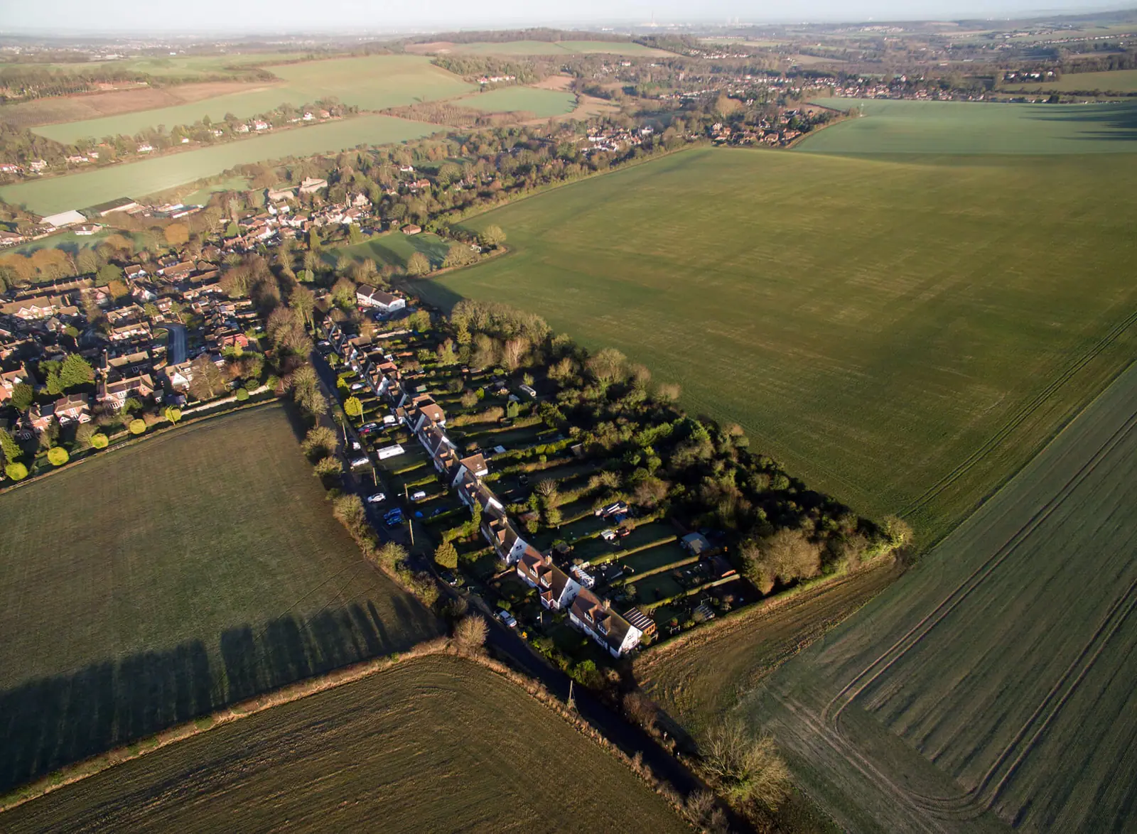 Aerial view across the Bower Lane site and surrounding Kent countryside