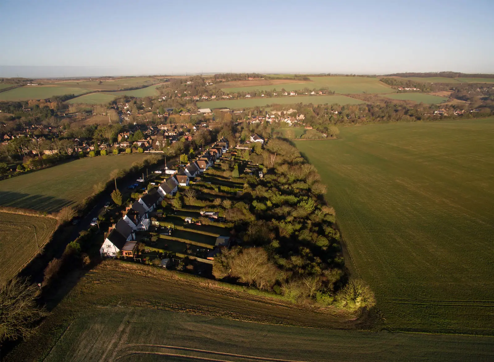 Aerial view of the field boundaries and the village beyond
