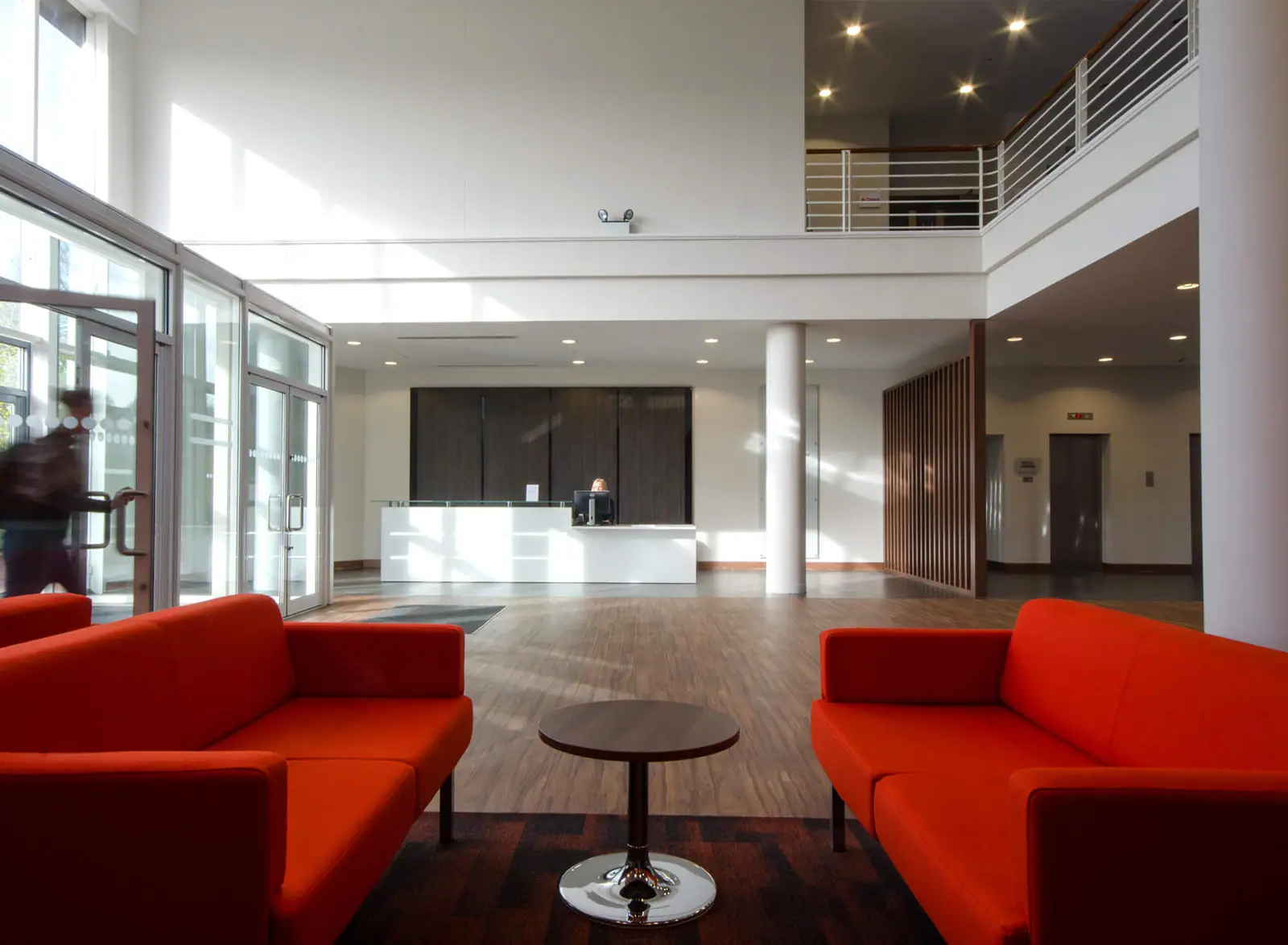 Reception seating area with red sofas
