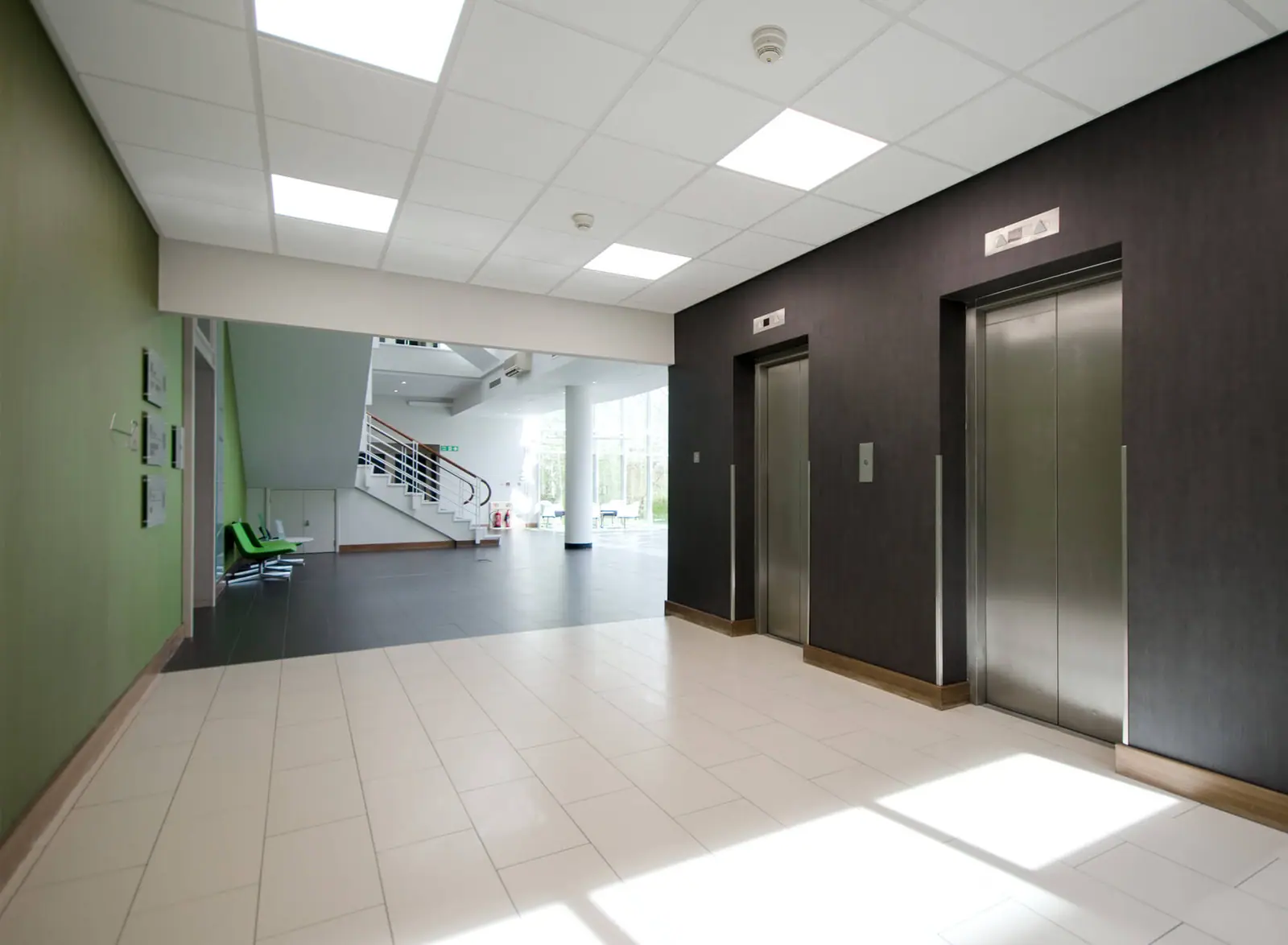Lift lobby with dark timber panelling