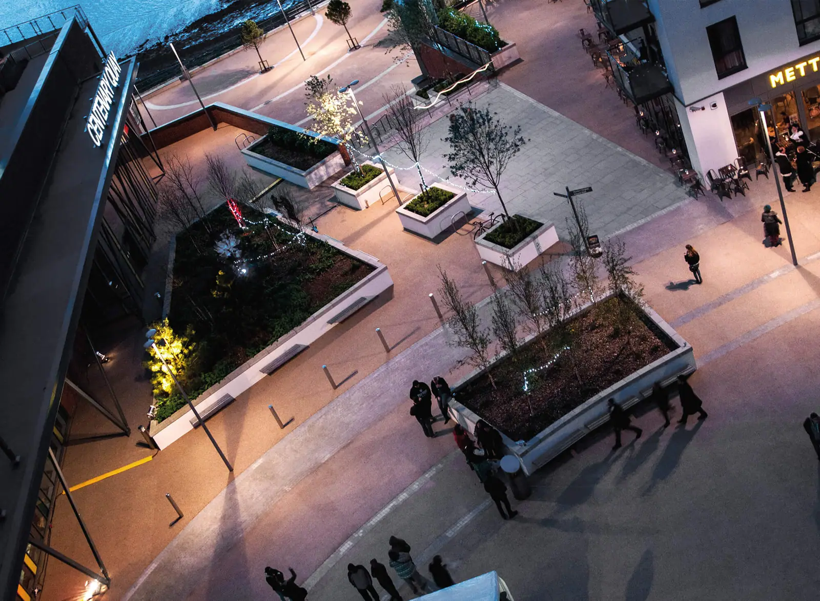 Centenary Quay square lit at dusk
