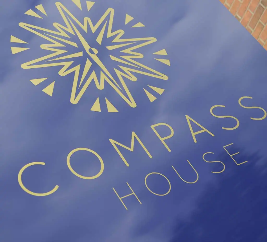 The new Compass House identity in gold on navy