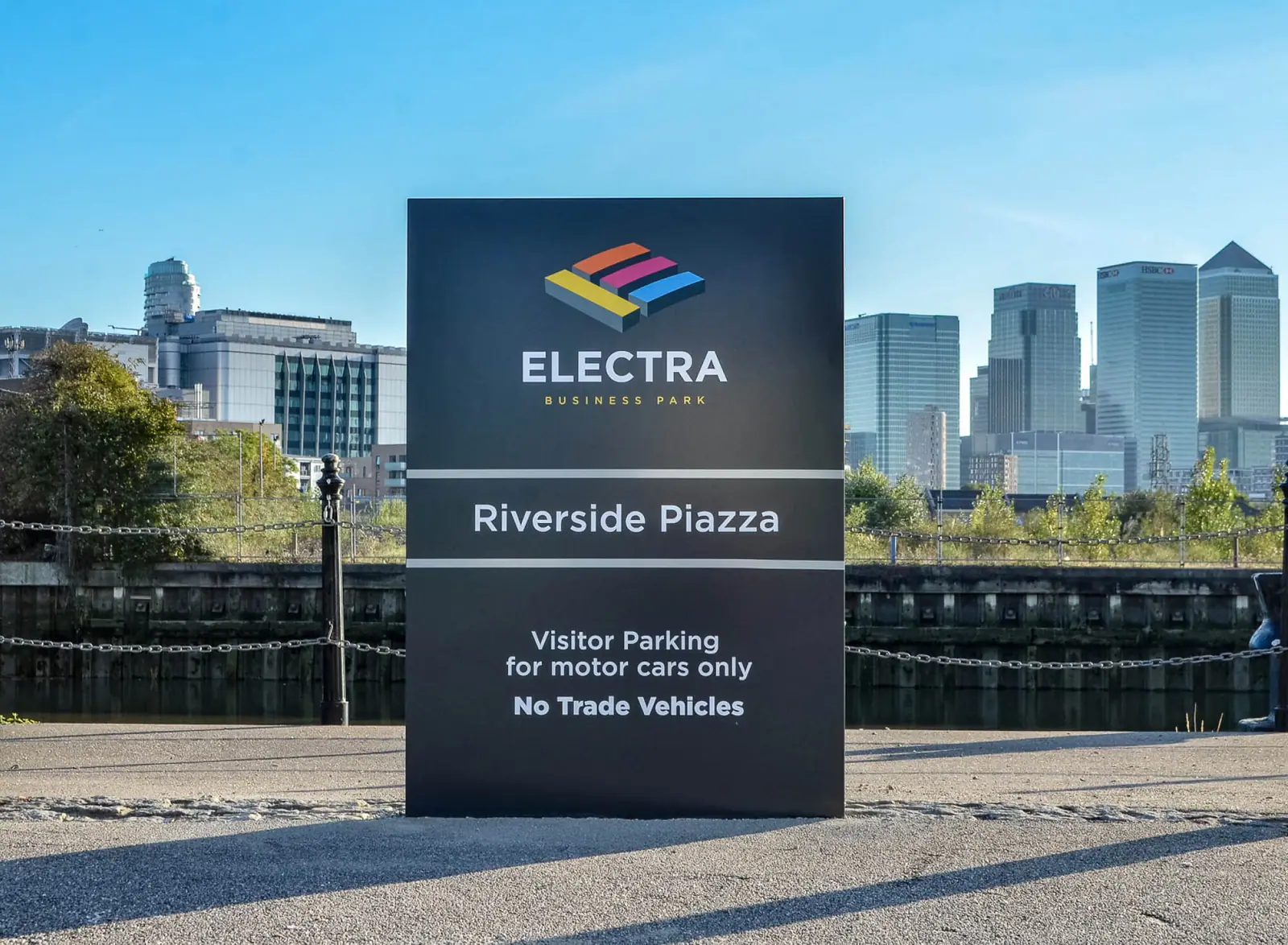 Electra Riverside Piazza sign with Canary Wharf behind