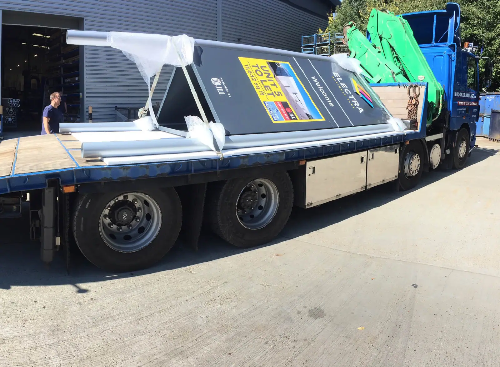 Finished Electra signs strapped to a lorry for delivery