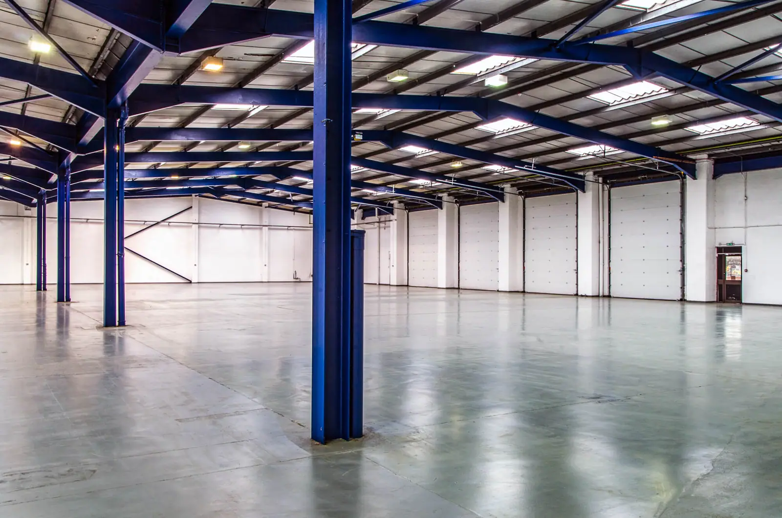 Refurbished warehouse interior with blue steel frame