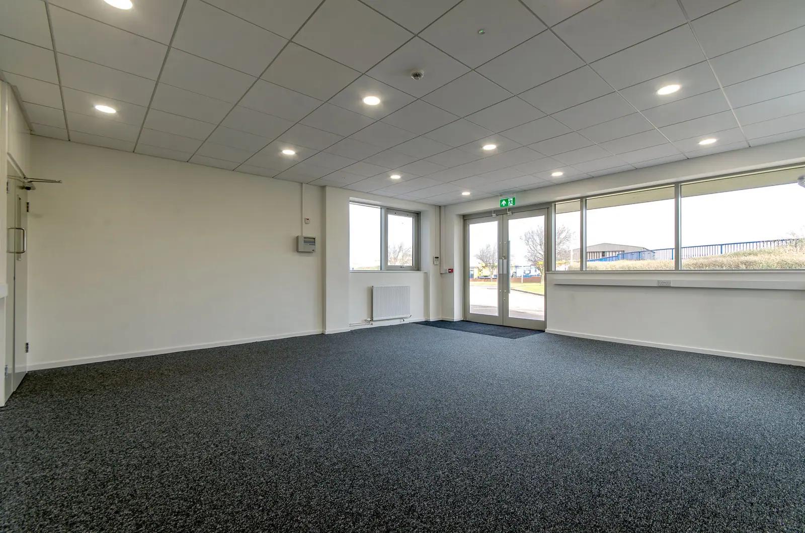 First-floor office suite, carpeted and empty