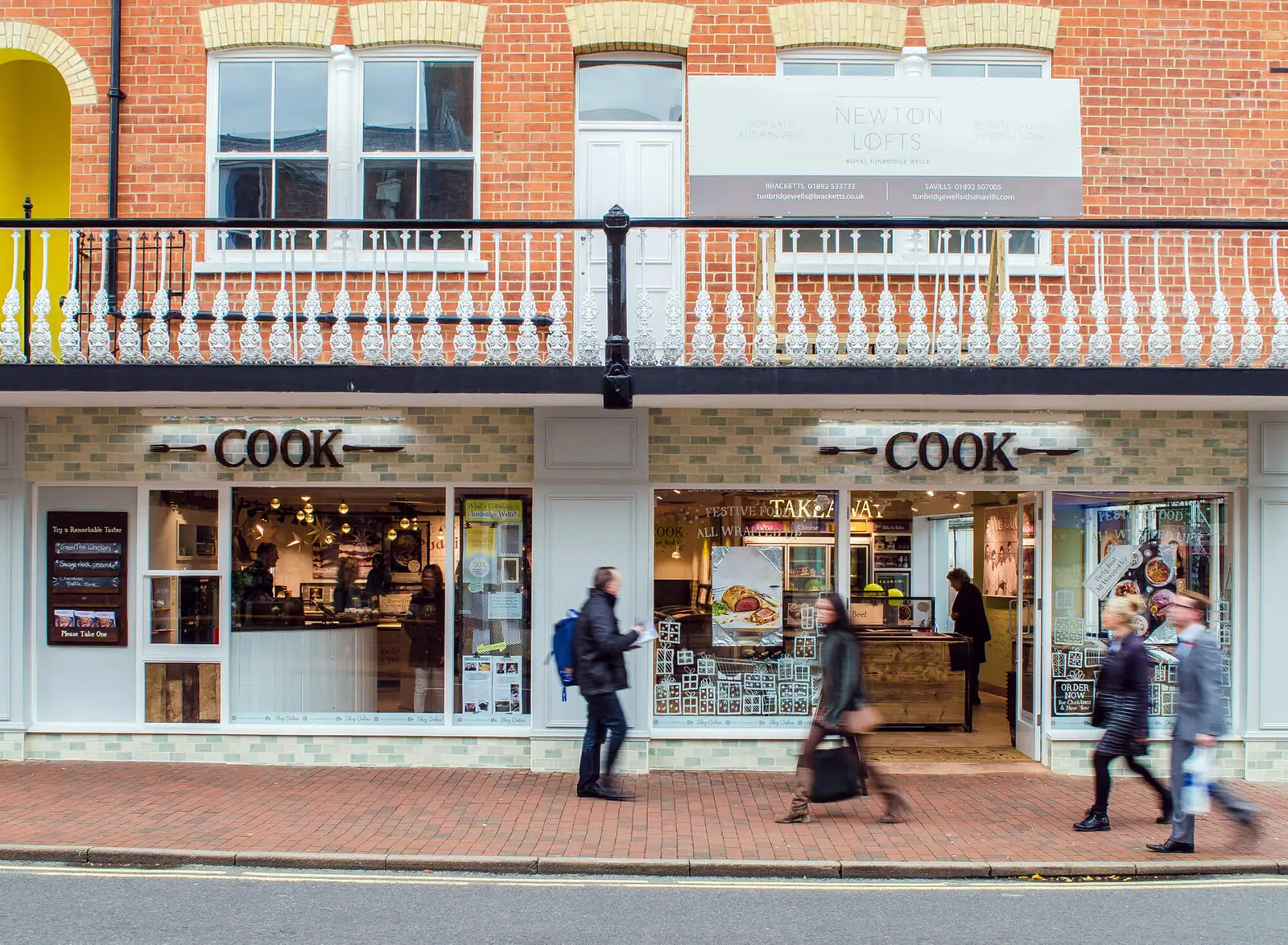 COOK shopfront on Monson Road with shoppers passing