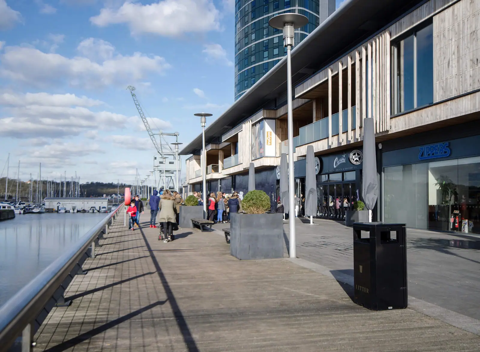 Visitors on the Pier 5 waterfront promenade