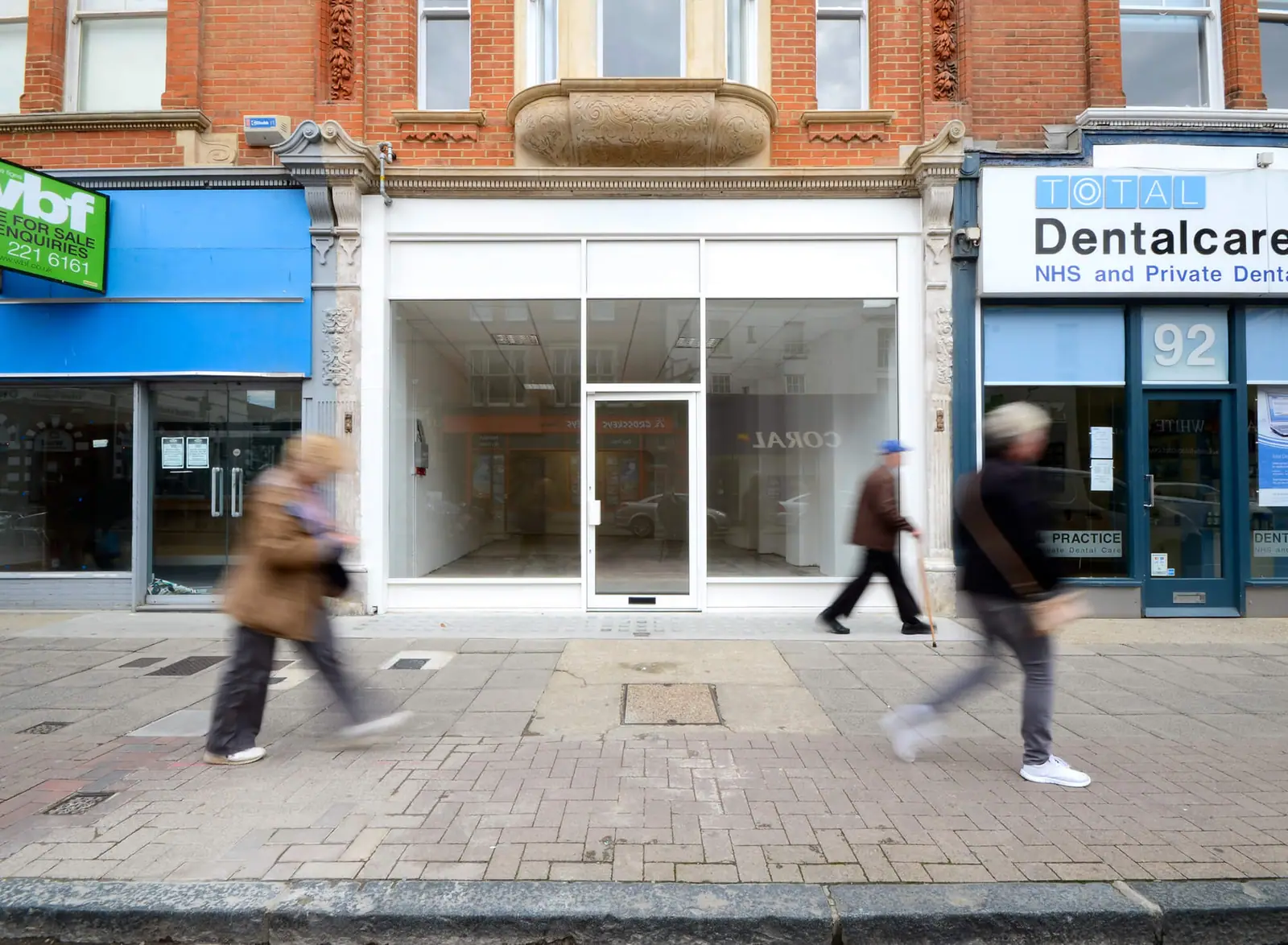 Empty shop unit on Sandgate Road with pedestrians passing