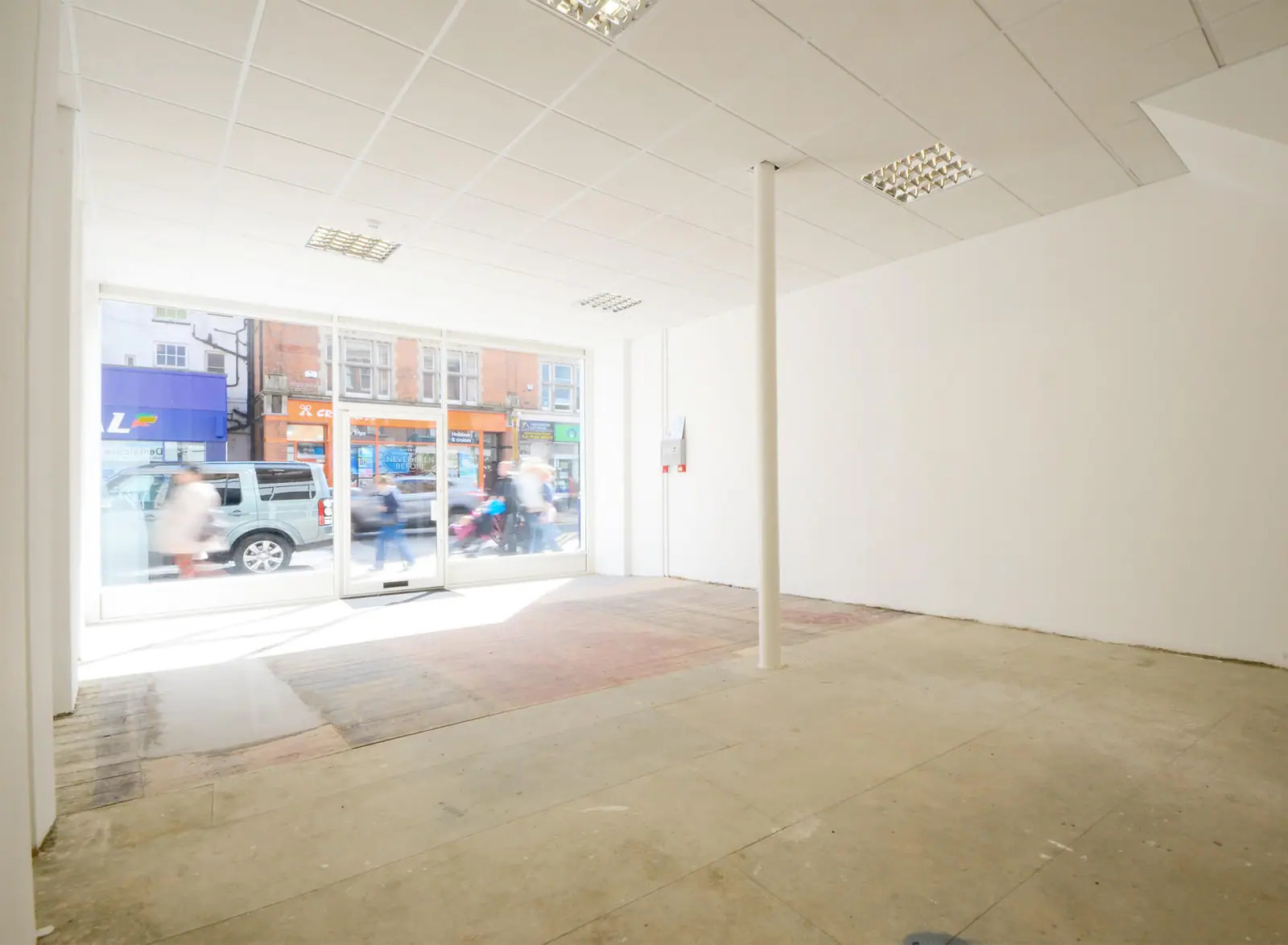 Empty shop interior with a full-height window