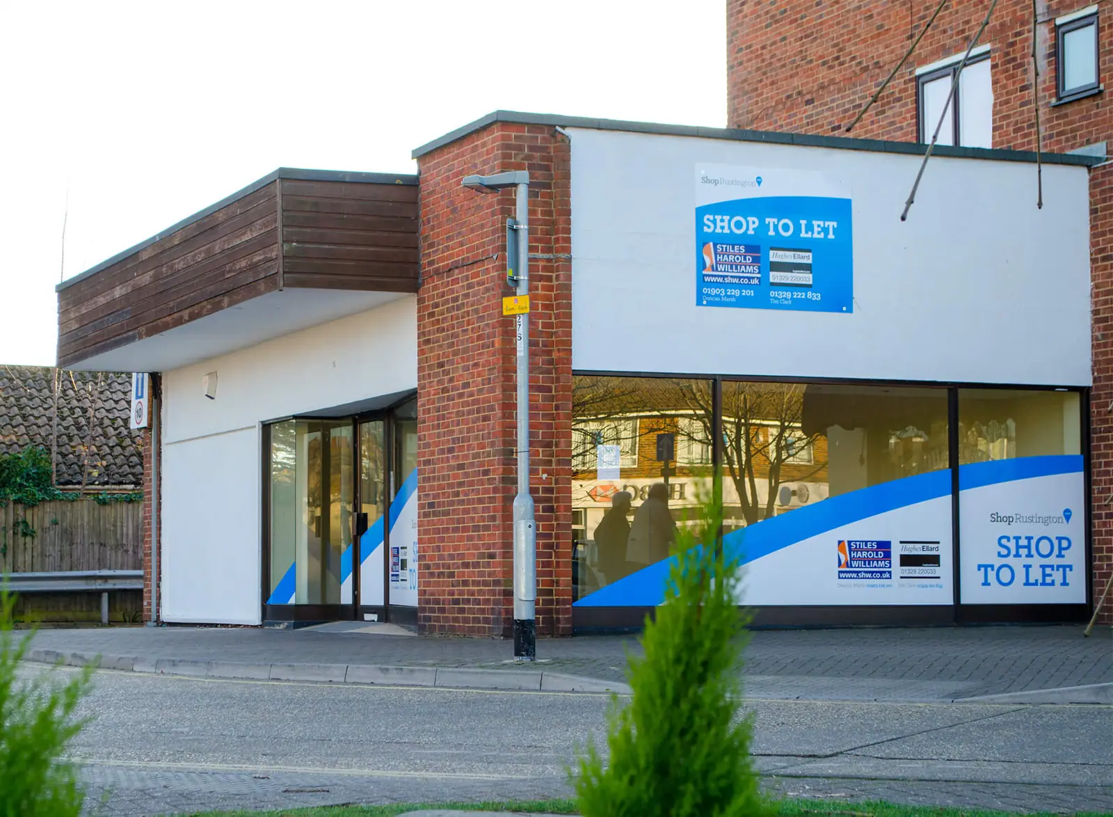 'Shop to let' fascia graphics on a vacant unit at Rustington