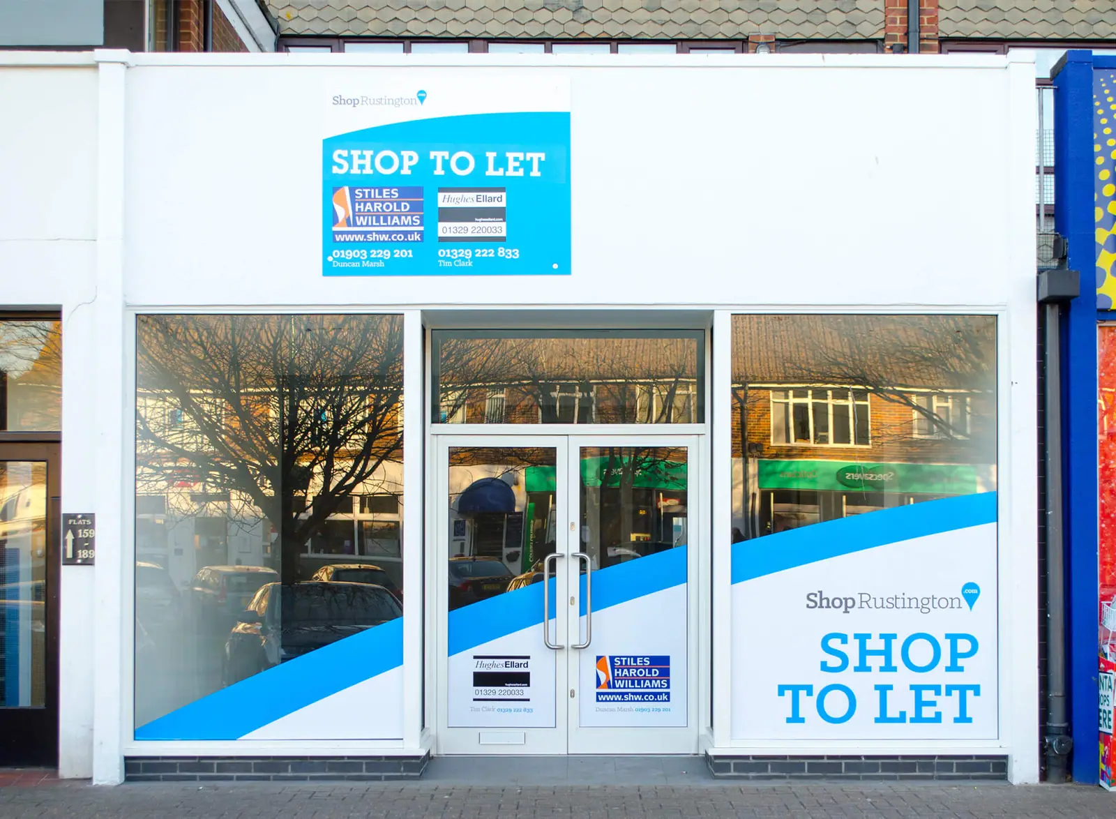 'Shop to let' window graphics on an empty unit