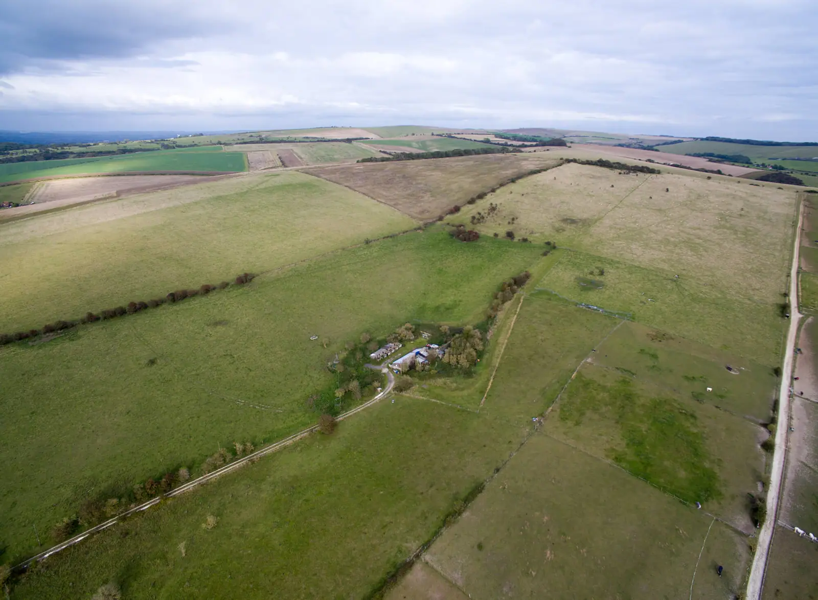 Farm buildings and fields at South Hill Farm from the air