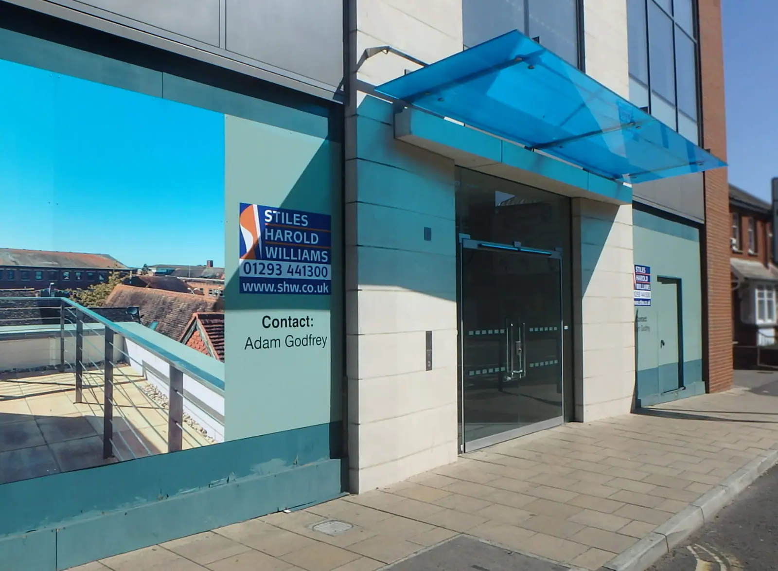 St Johns House hoarding graphics on the glazed ground floor