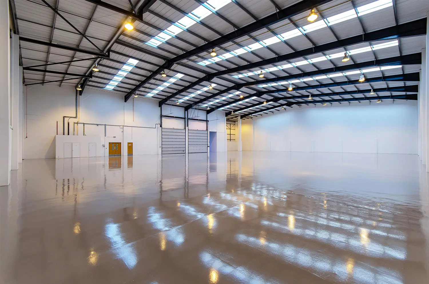 Bright warehouse interior with reflections on the floor