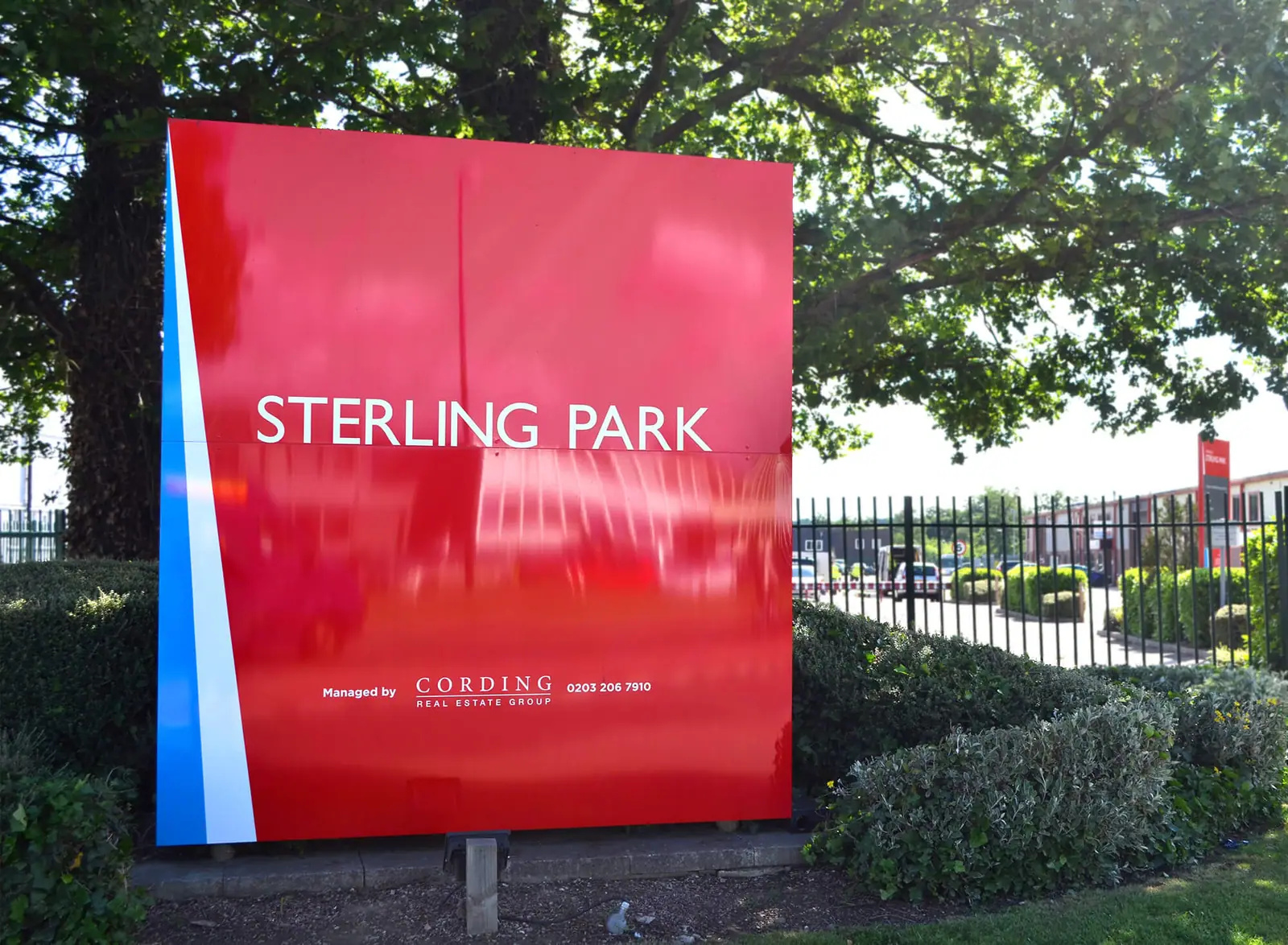 Finished red Sterling Park sign at the estate entrance