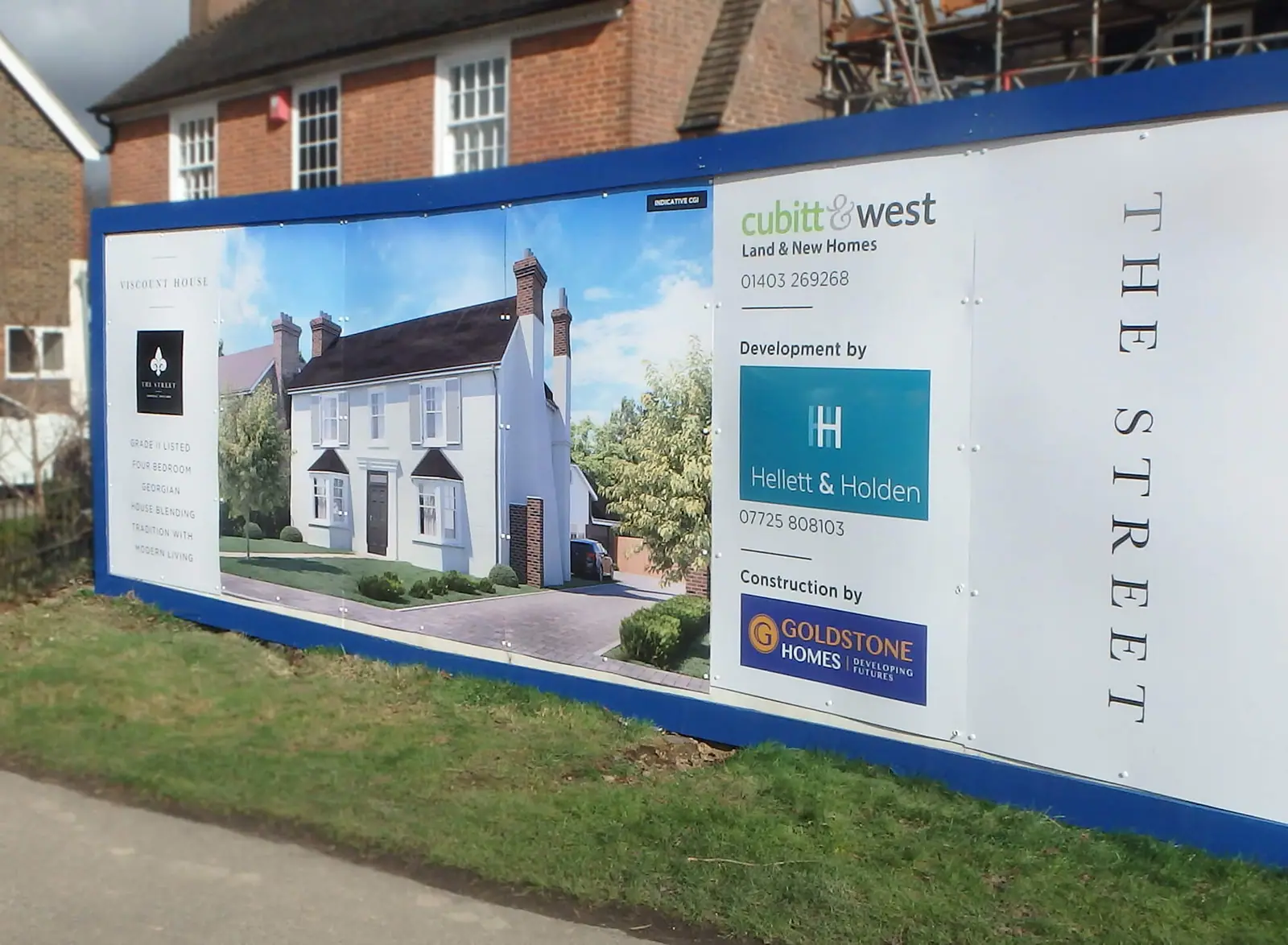 The Street development hoarding with a CGI of the homes