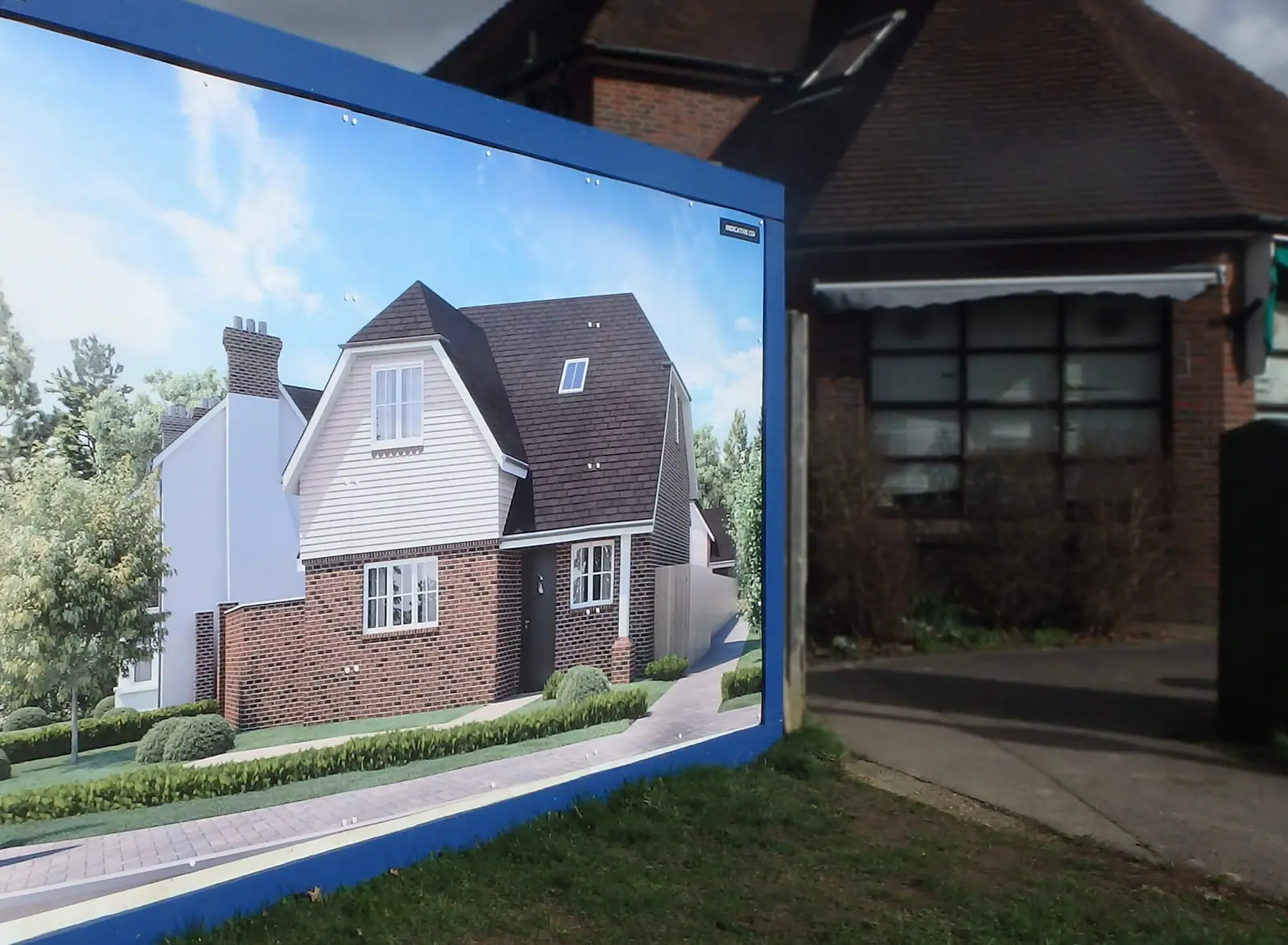 Hoarding panel with a CGI of a detached home